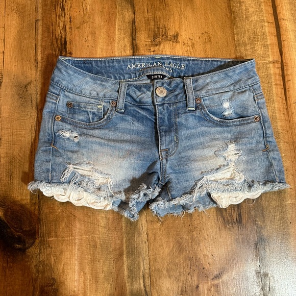 Women’s American Eagle Shortie Denim Shorts. Eyelet distressed. Size 0 - Picture 2 of 6